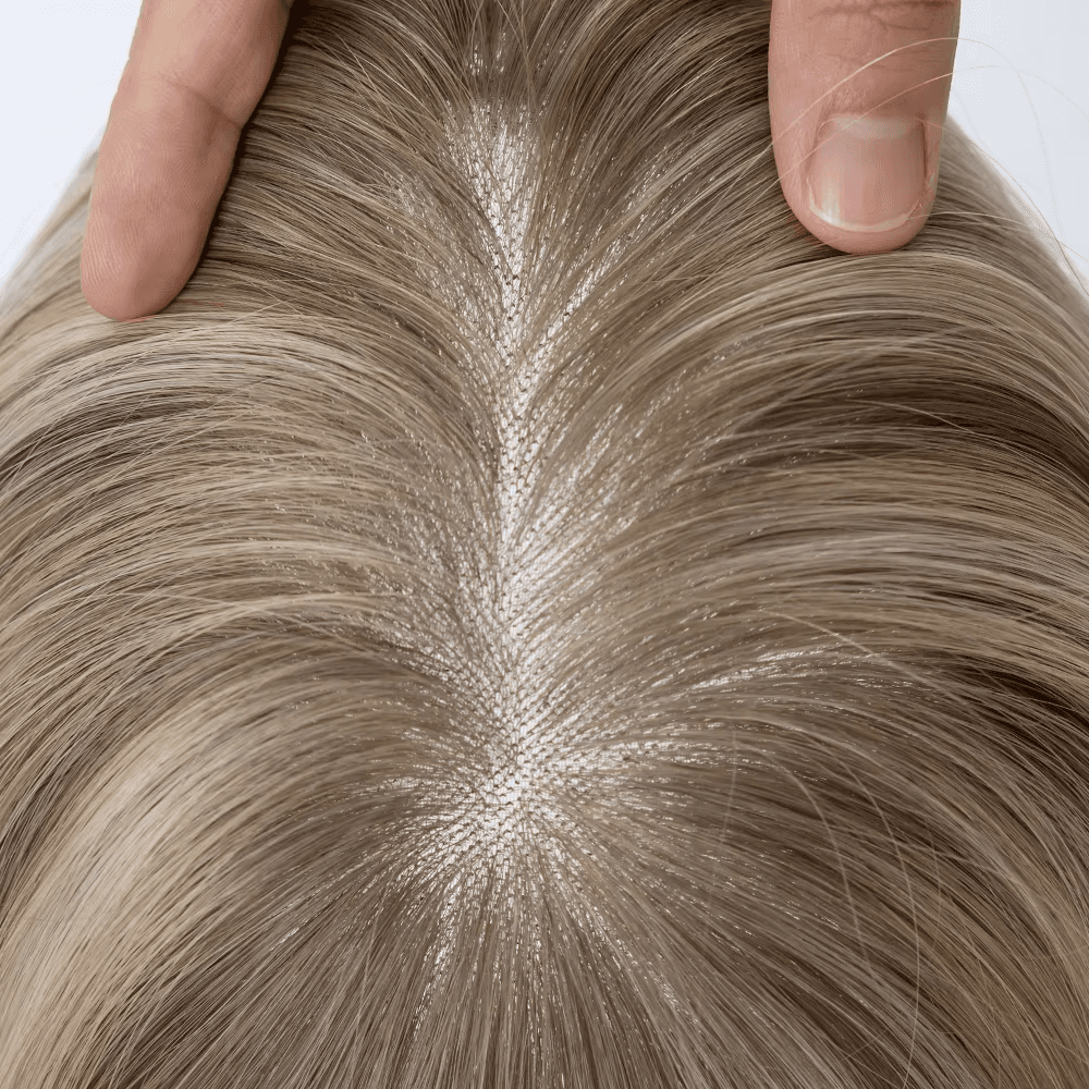 Blonde Bead-In Mono Topper showing a natural-looking hair part