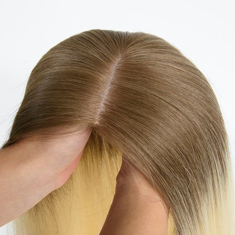 Blonde fishnet topper showing a natural-looking centre part