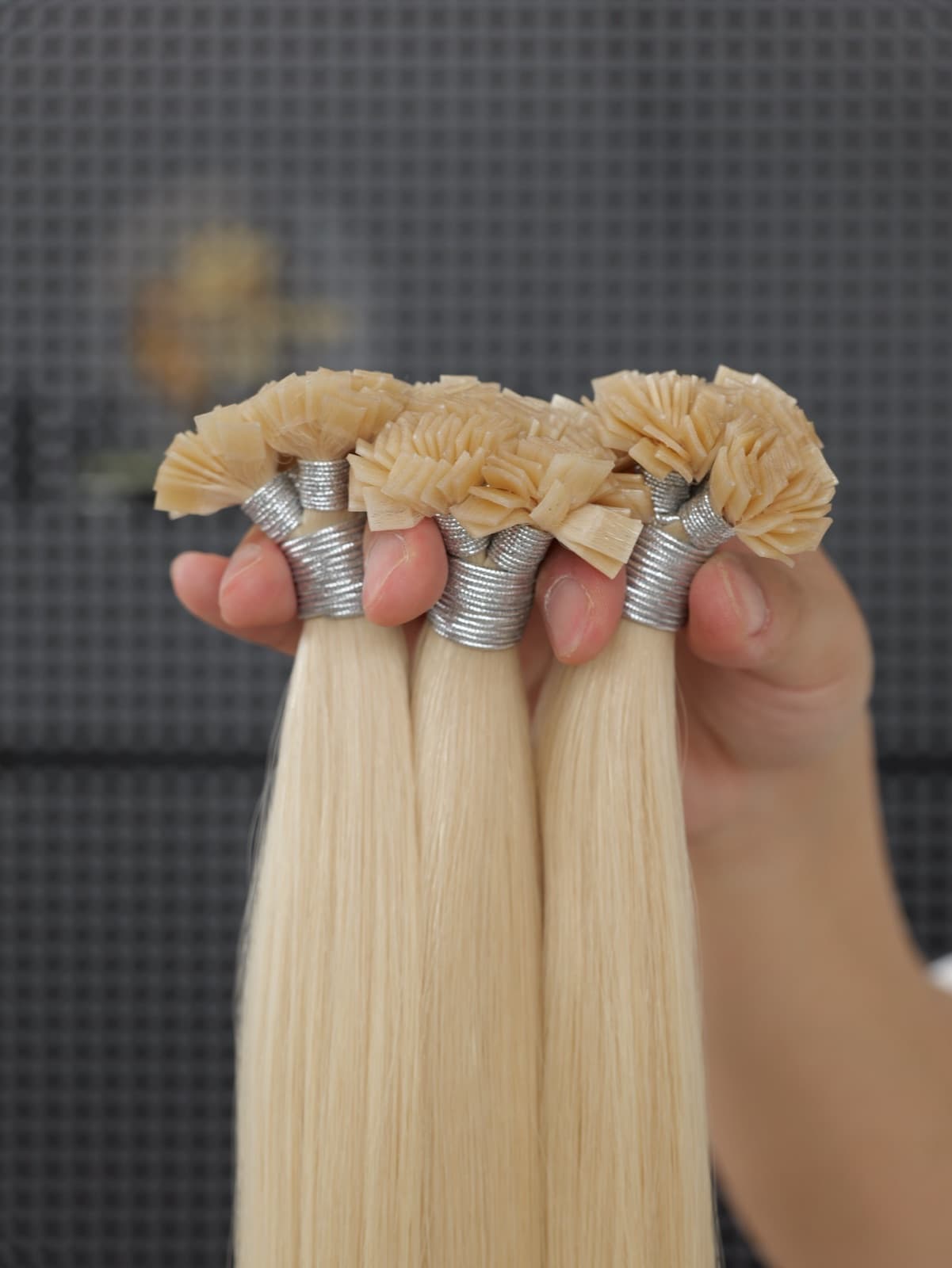 Light blonde Flat Tip human hair extensions with close-up keratin bonds
