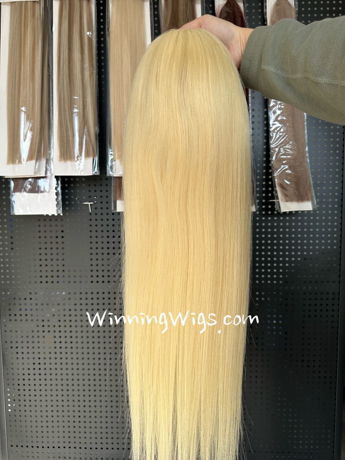 Back view of a long straight blonde full lace virgin human hair wig