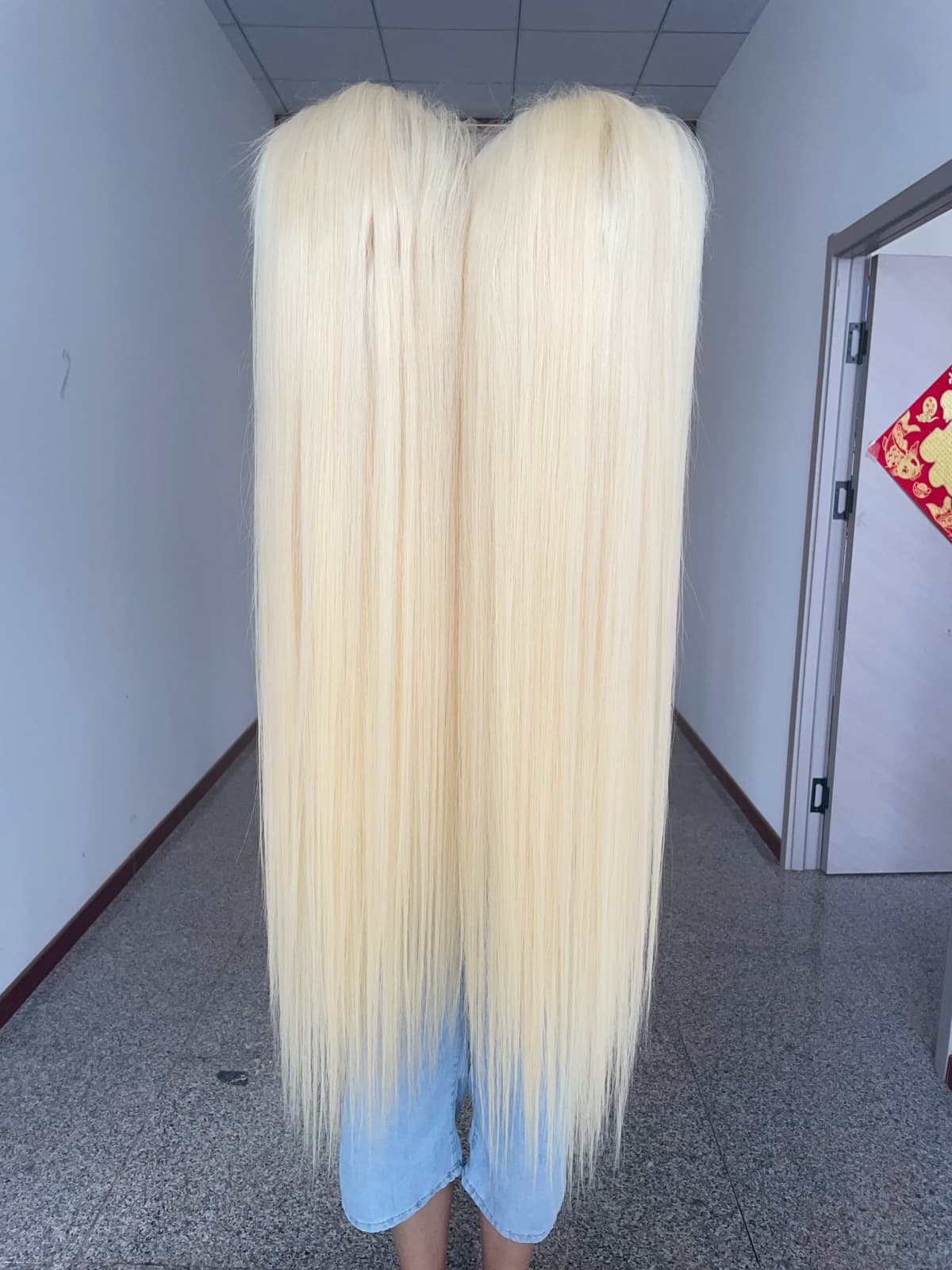 Long straight blonde full lace virgin human hair wig showing full length