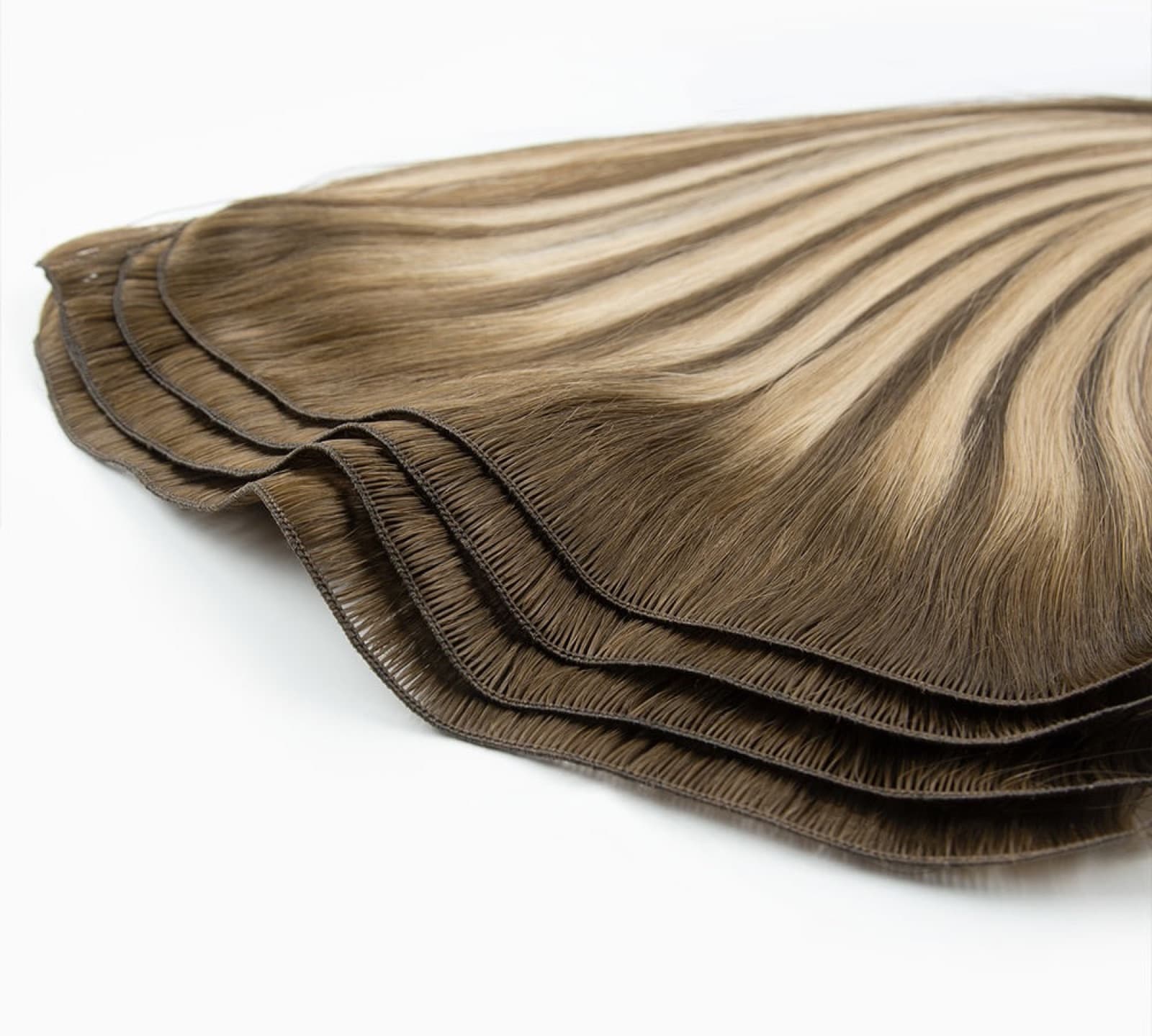 Layered Hand-Tied Weft human hair extension seam construction detail