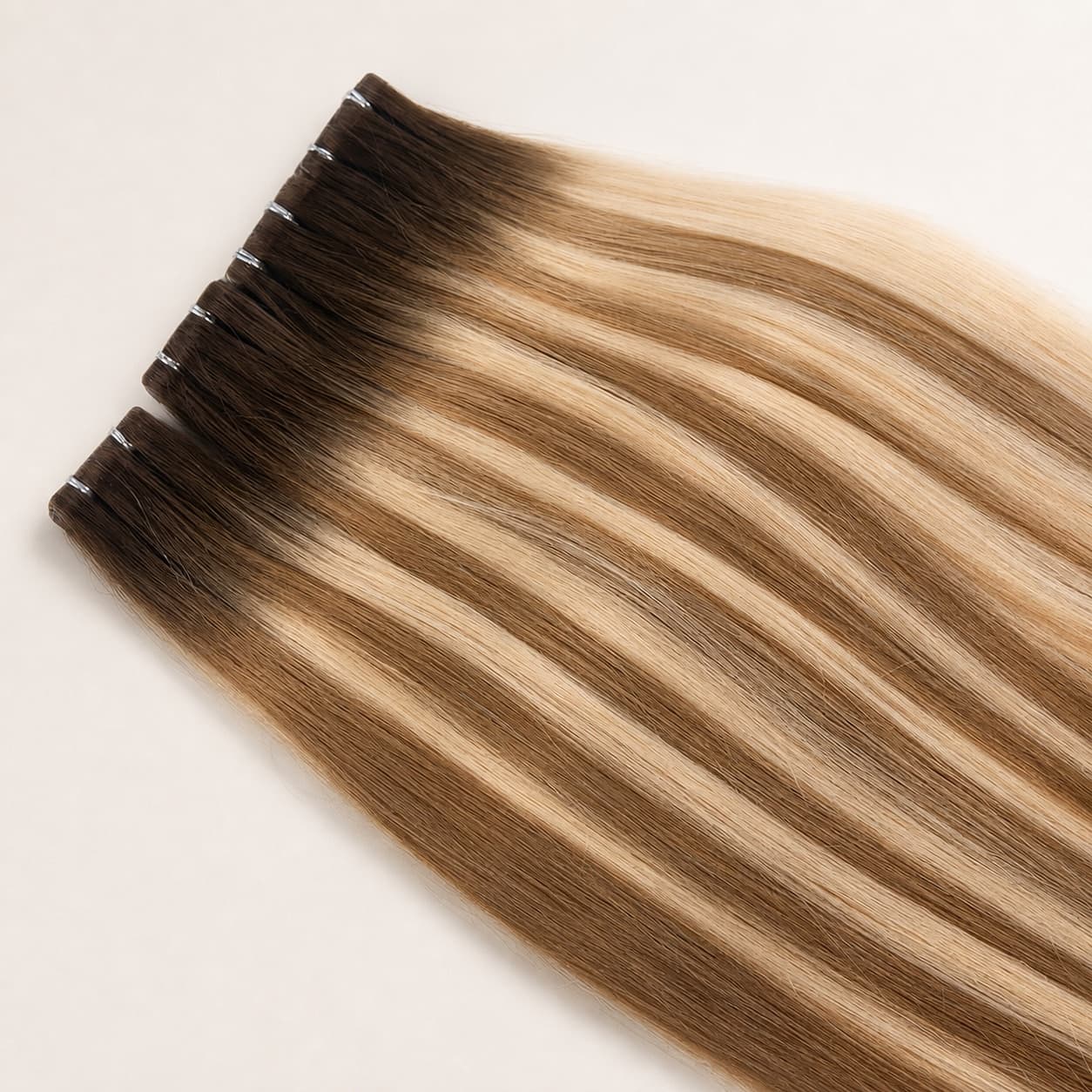 Long balayage invisible tape-in human hair extensions with low-profile attachment tabs