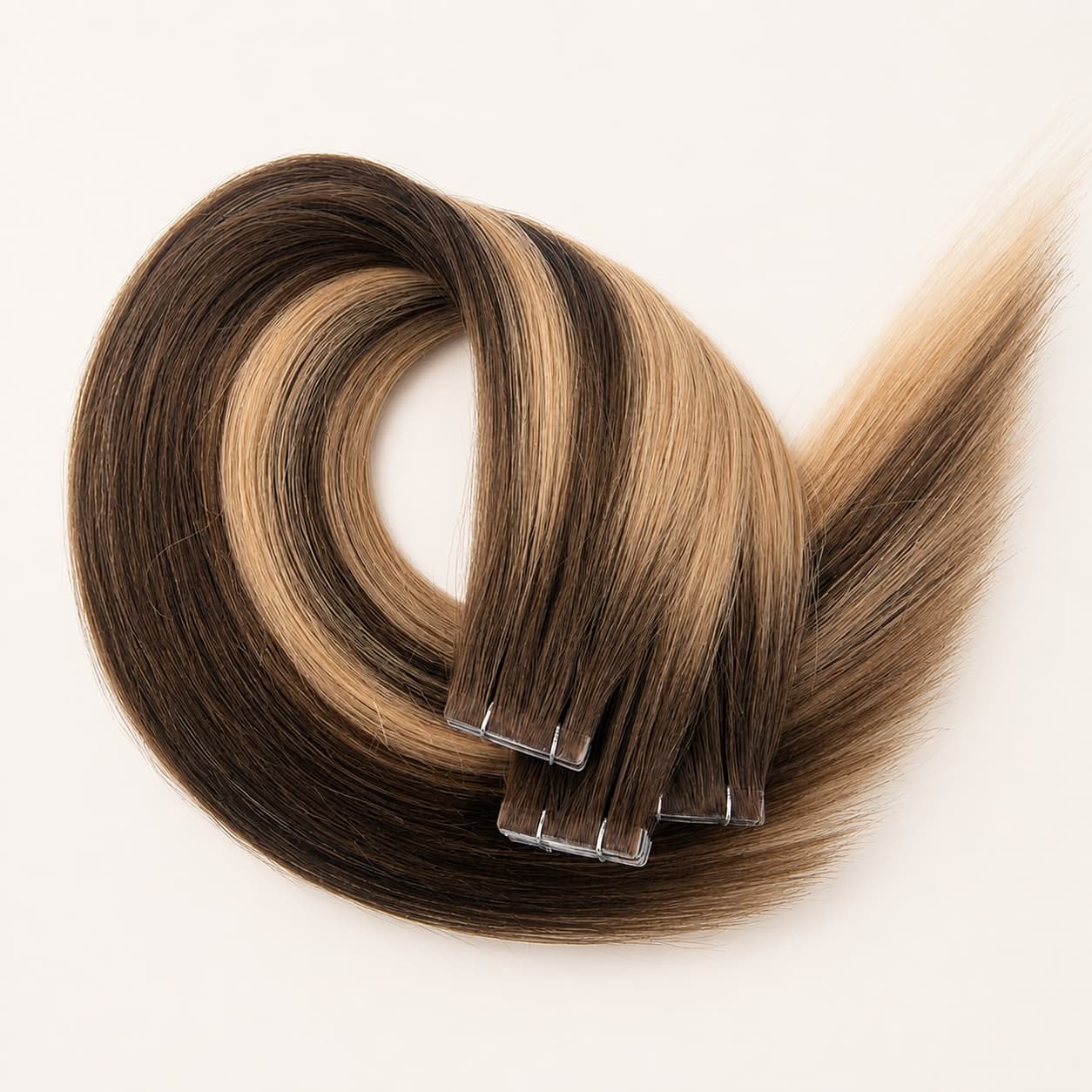Invisible tape-in human hair extensions with a seamless, low-profile attachment