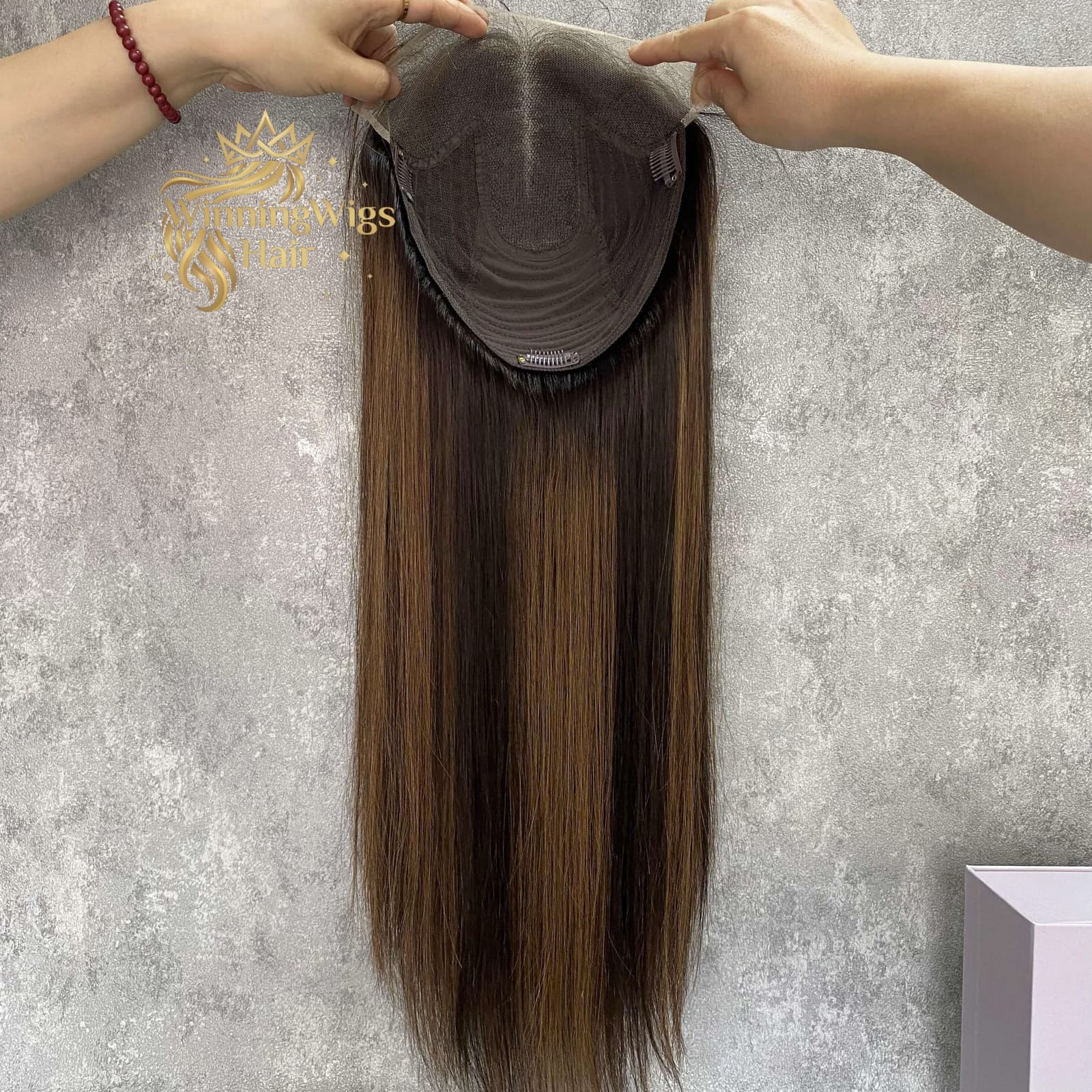Brown lace topper interior showing a full lace front, breathable cap and pressure clips