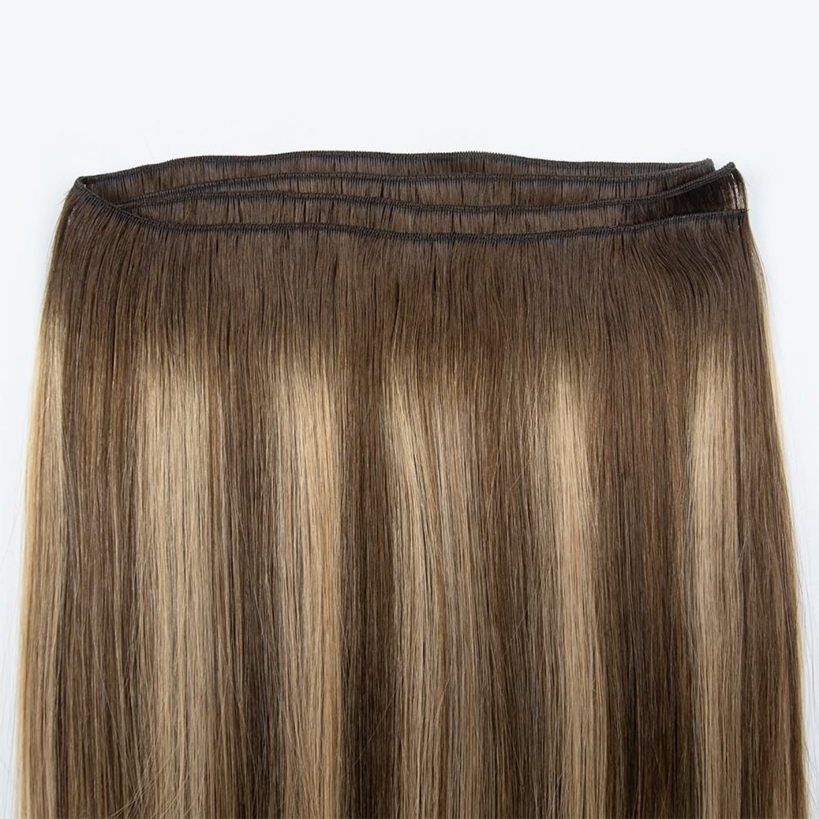 Machine Weft reinforced sewn seam detail in brown and blonde human hair