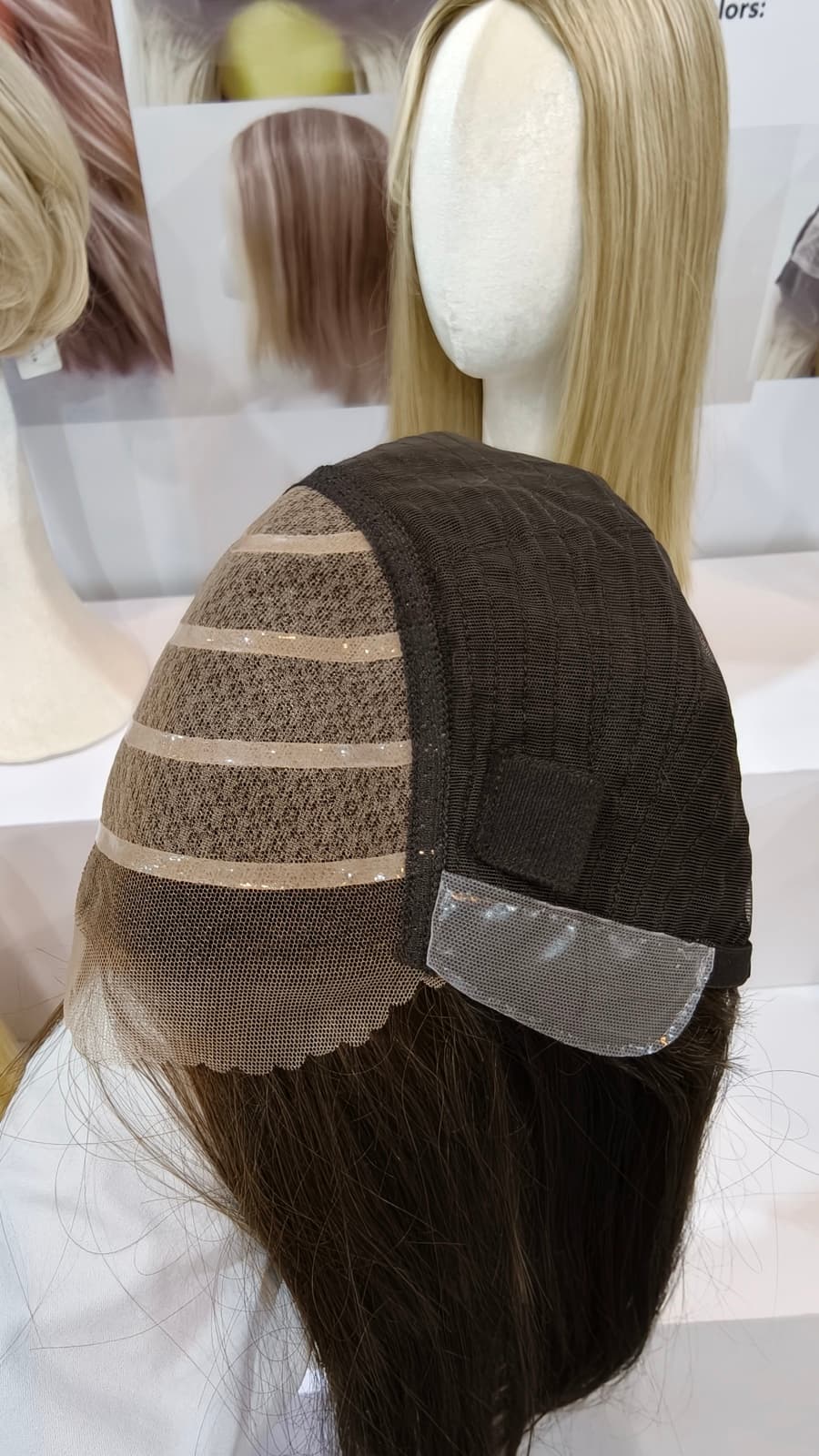 Medical human hair wig cap construction with a silicone grip panel and lace front