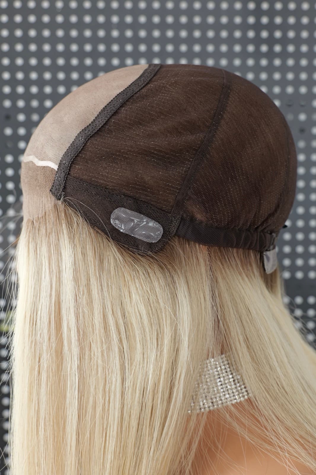Medical human hair wig cap side construction with a silicone grip panel