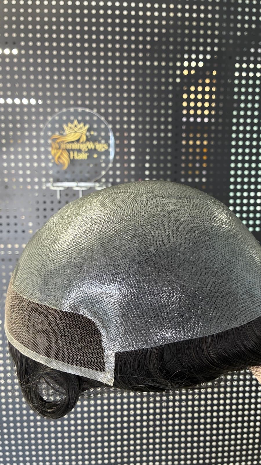 Men's hair system rear view showing the breathable lace base