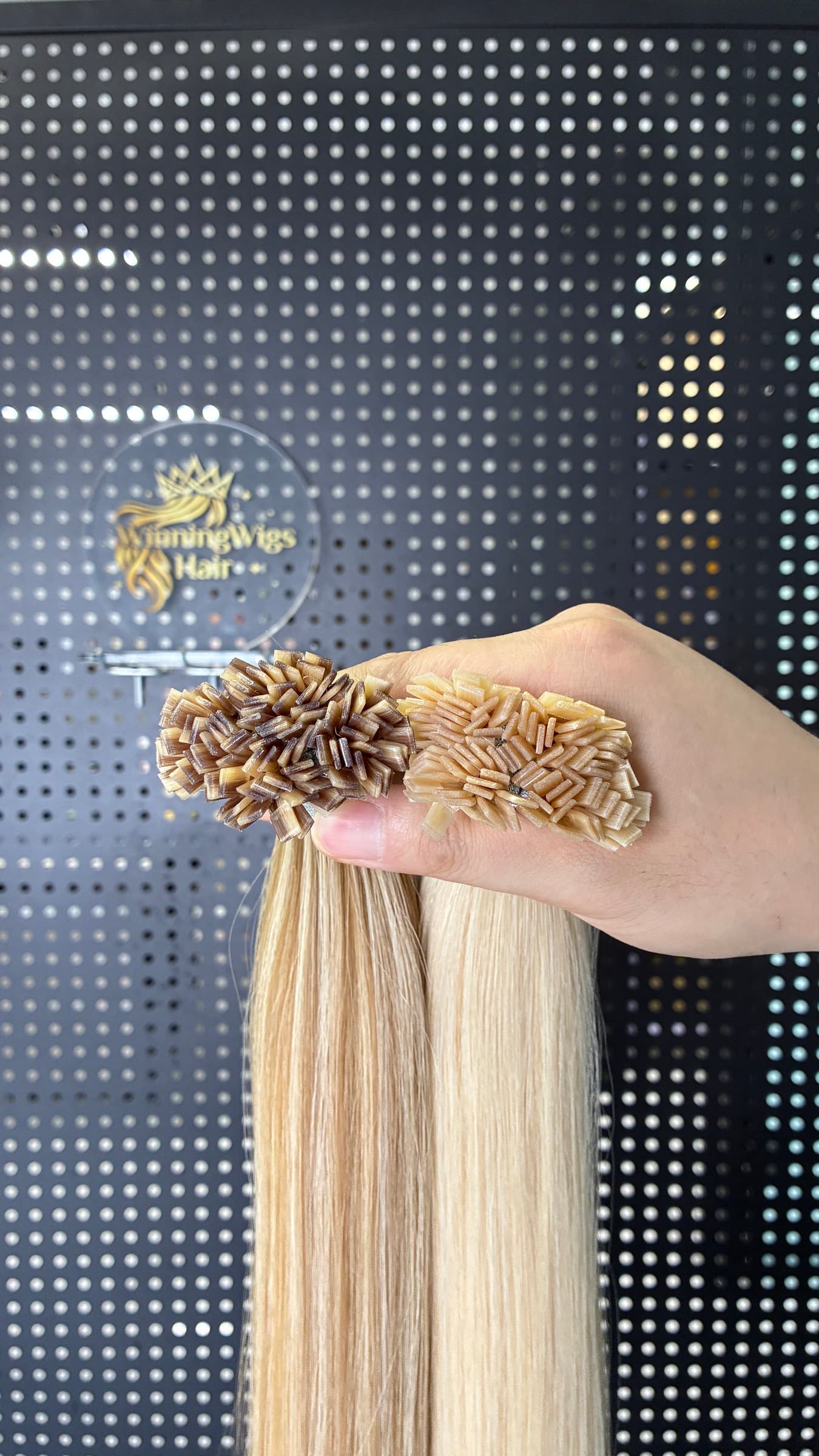 Close-up of Flat Tip heat-fusion keratin bond ends in two color shades