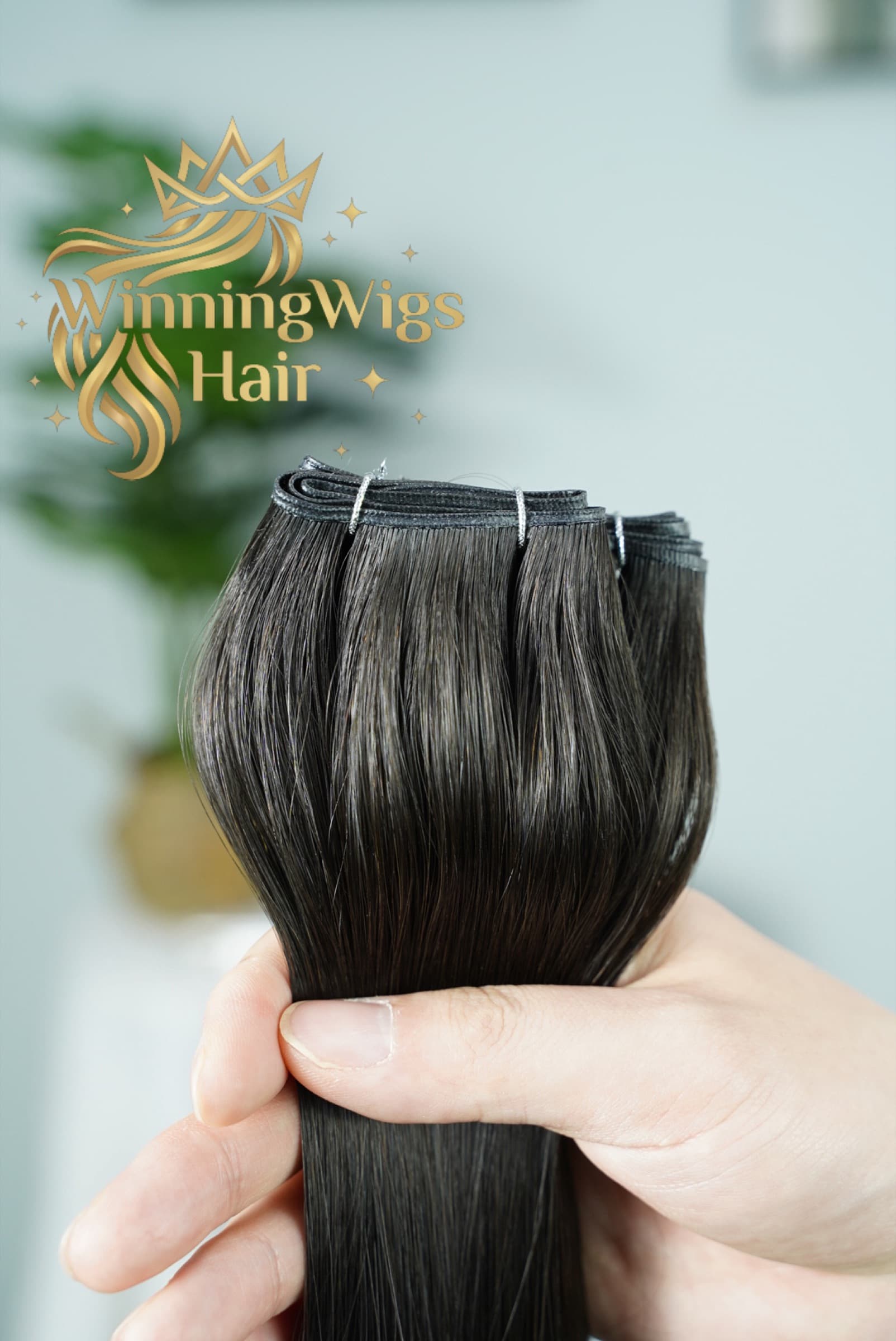 Dark Genius Weft human hair extension bundle showing the slim weft seam