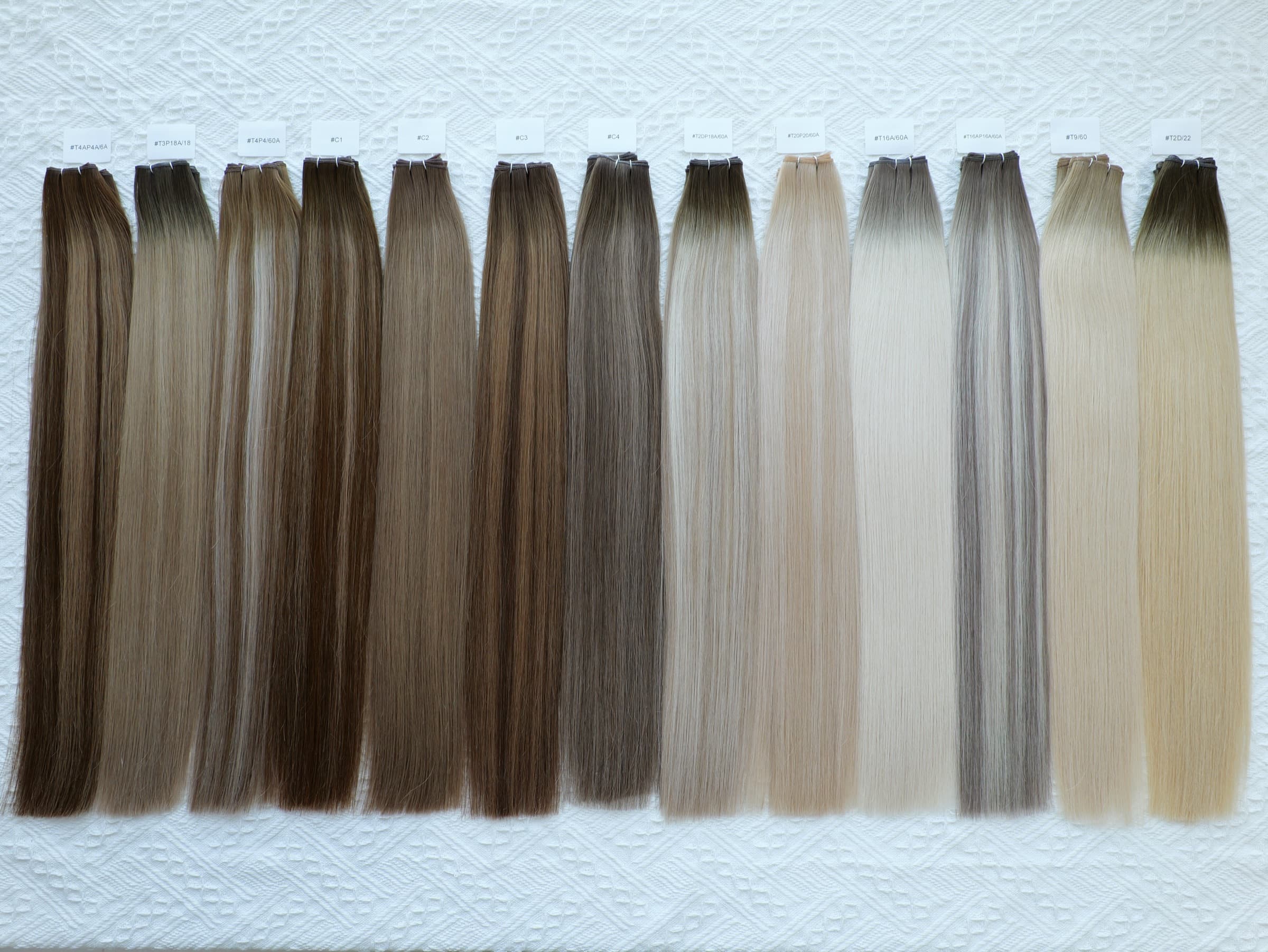 Genius Weft straight human hair extension shade range with labeled color references
