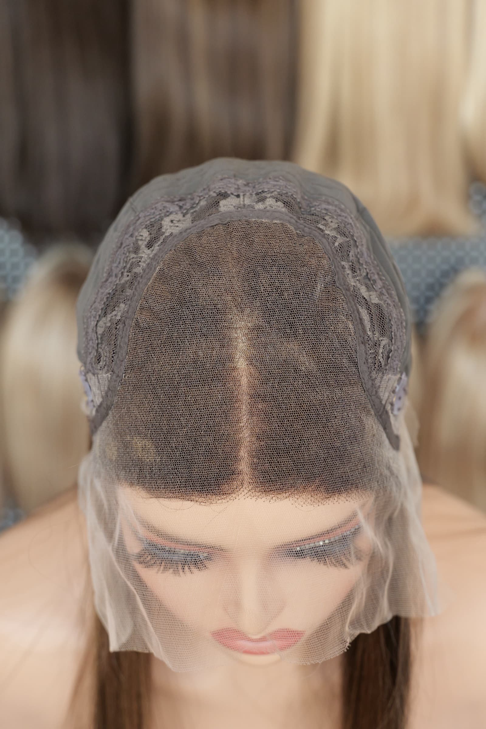 Top interior of an HD lace top human hair wig showing the lace panel and cap construction