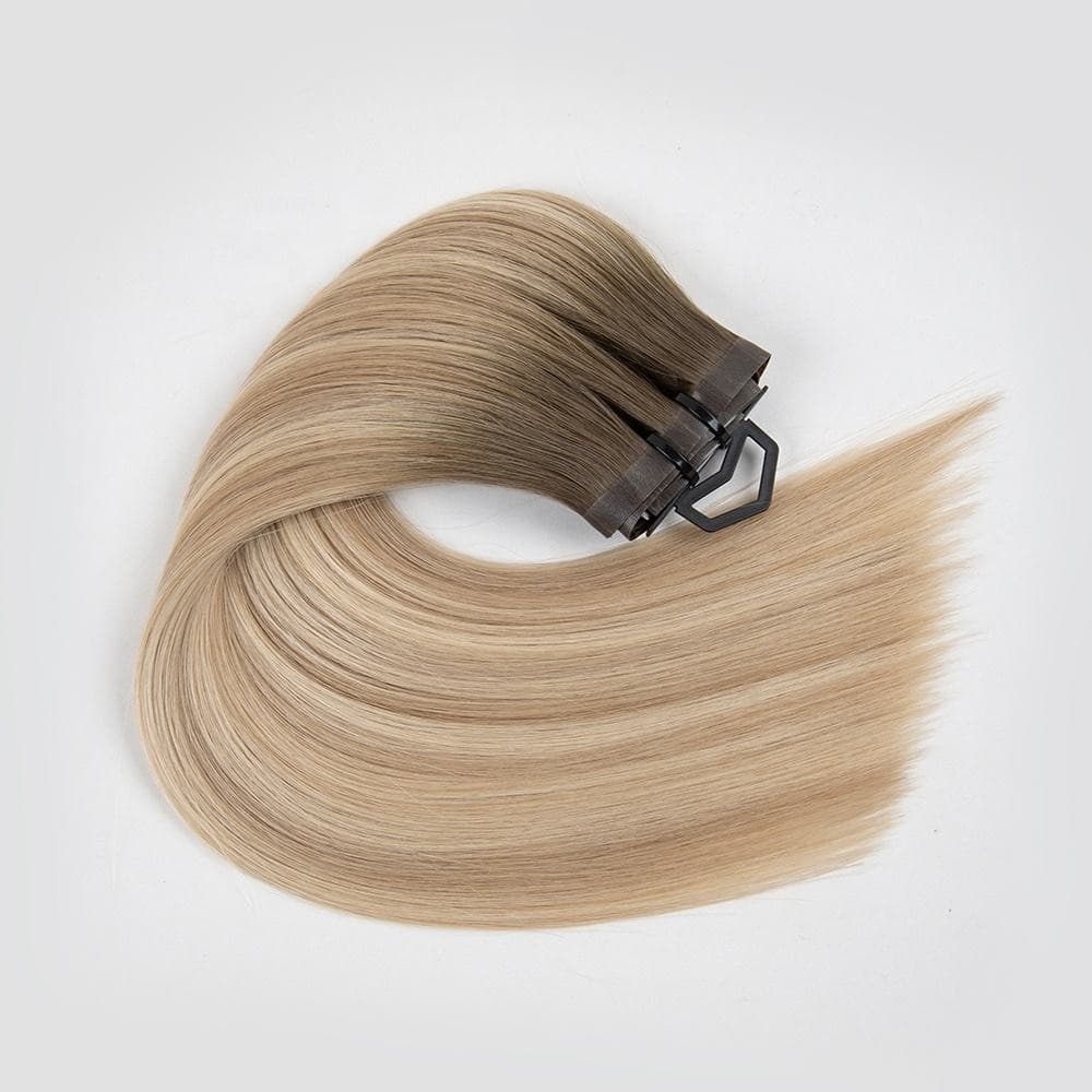 Light blonde PU Clip-In human hair extension bundle with a smooth polyurethane attachment base