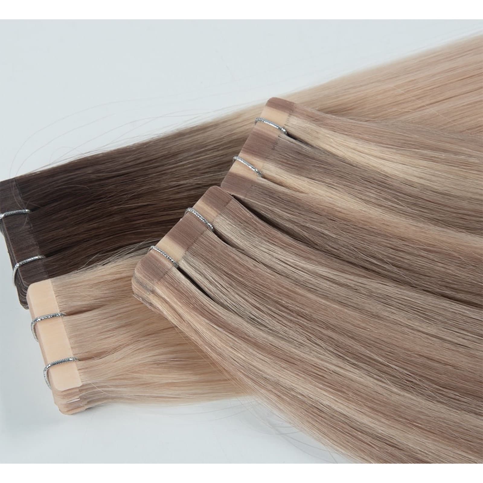 Regular Tape-In human hair extension bundles in natural brown and blonde shades
