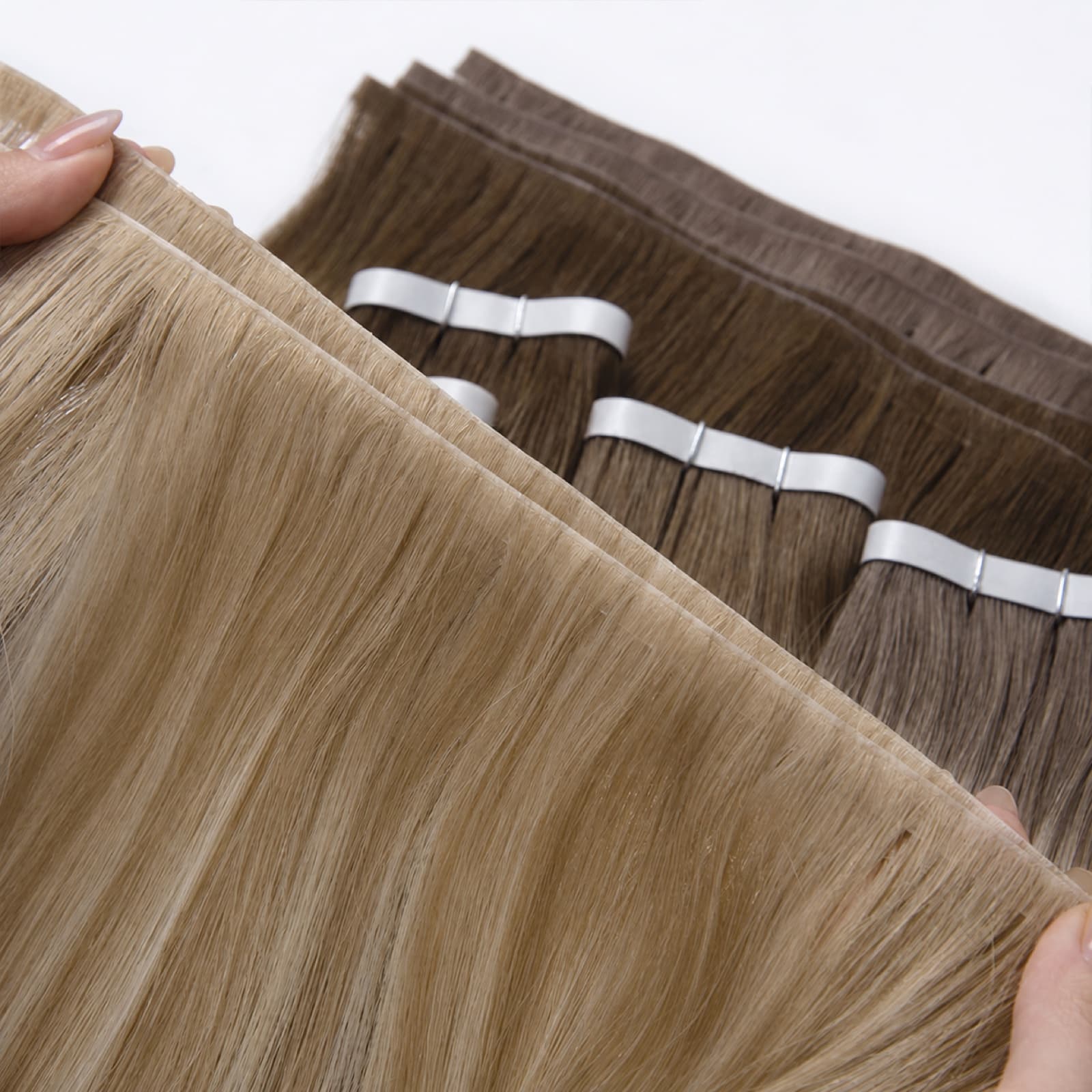 Blonde and brown Tape Weft Extensions with visible flexible weft panels